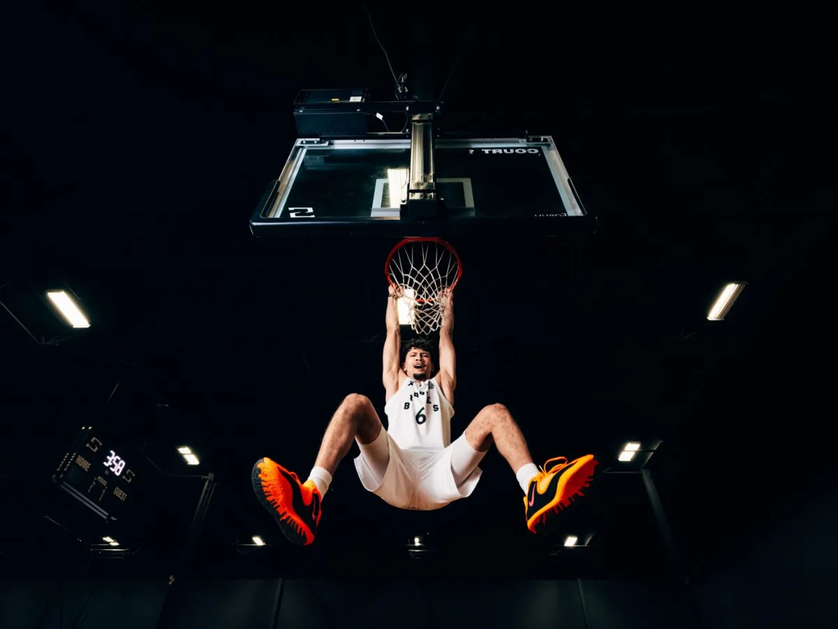 BRODIE® athlete rising for a dunk