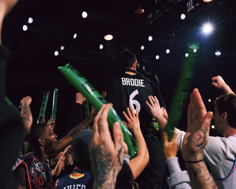 Crowd celebrating a Brodie player