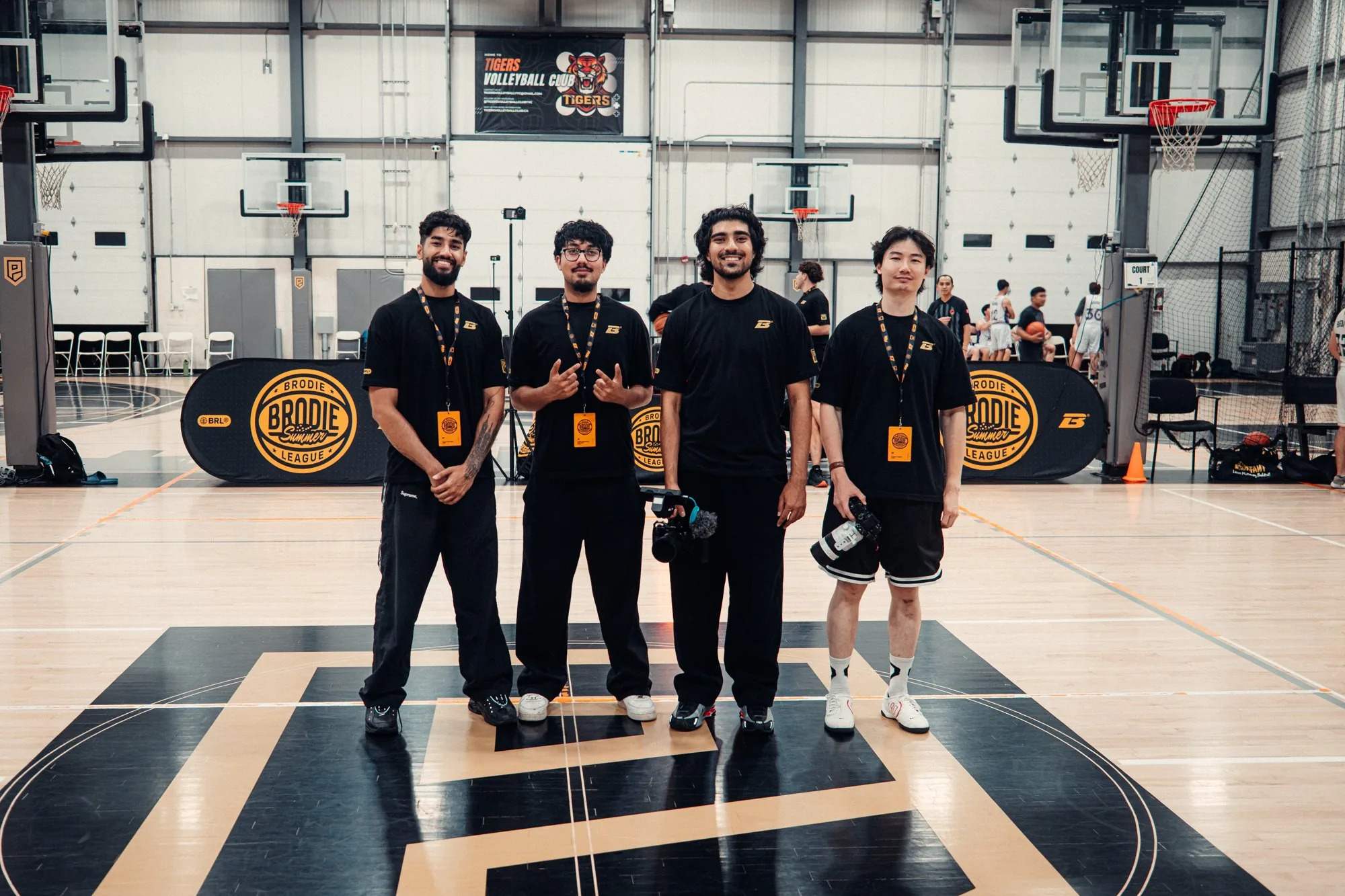 BRODIE staff lined up courtside at a game night