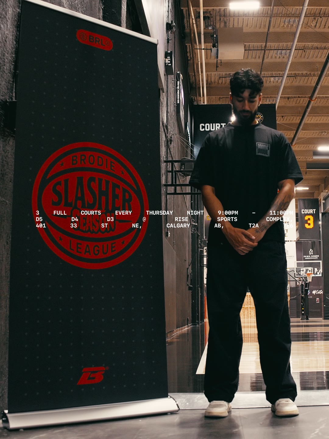 Brodie City Launcher standing in front of a Slasher League banner