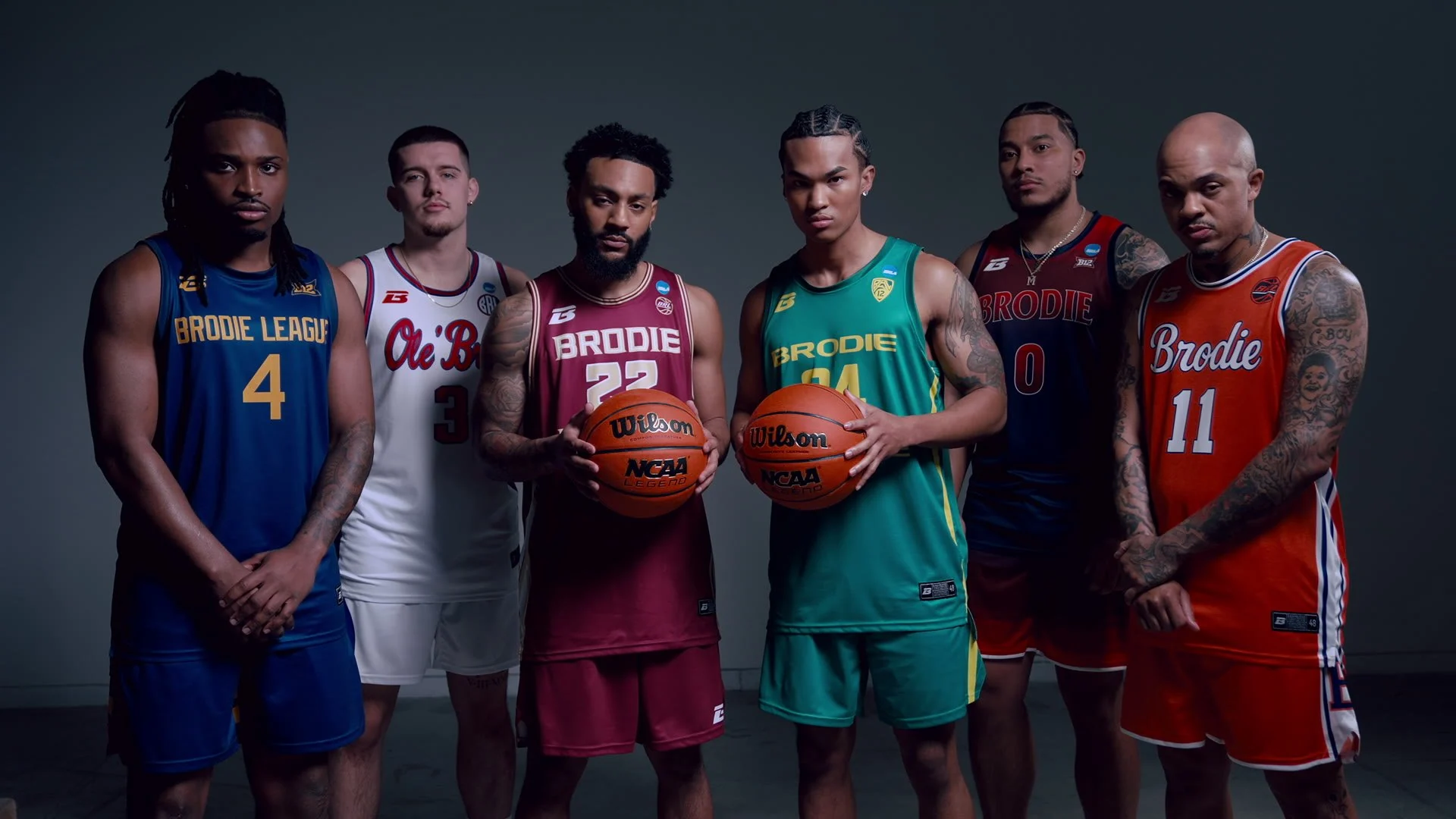 Six Bracket Season athletes in their jerseys holding basketballs
