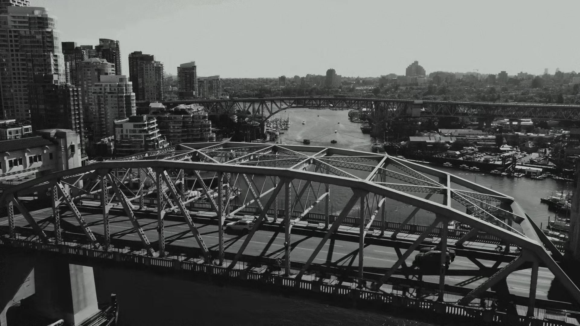 Aerial view of a bridge over False Creek in Vancouver, in black and white