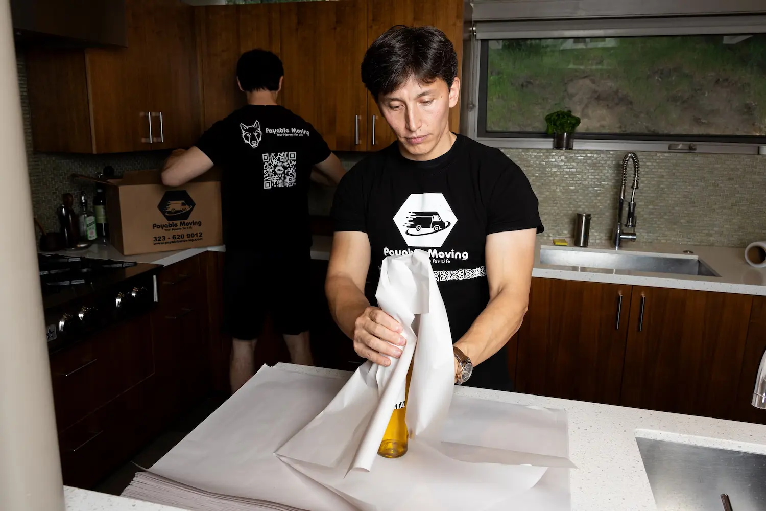 Residential movers preparing items for safe transportation