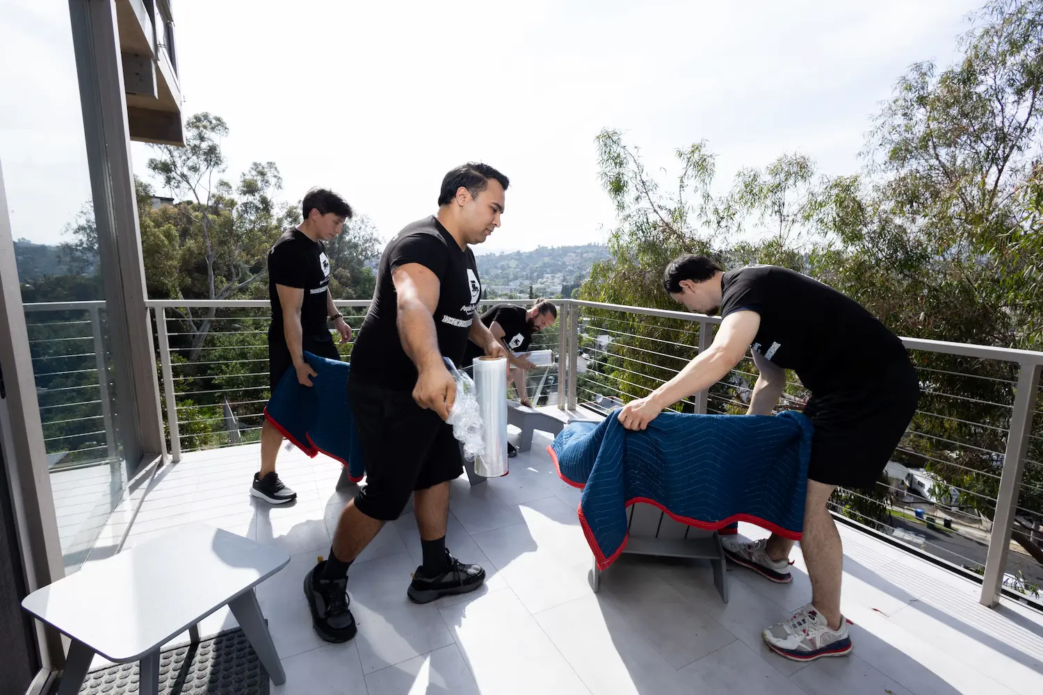 Moving crew unloading furniture at a new home