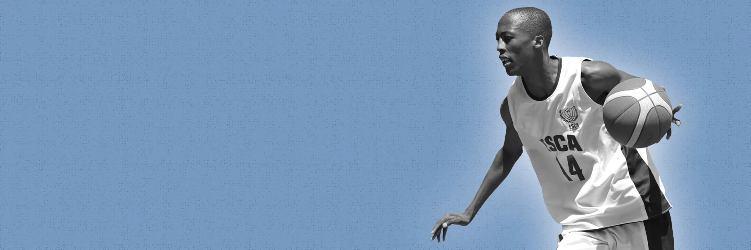 Two young men in white shirts holding basketballs against a dark background, one spinning a ball on his finger and the other smiling while holding a basketball.