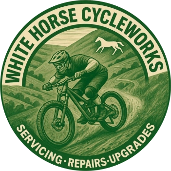 Green circular logo with a mountain biker riding downhill and a white horse silhouette, surrounded by text 'WHITE HORSE CYCLEWORKS' and 'SERVICING • REPAIRS • UPGRADES'.
