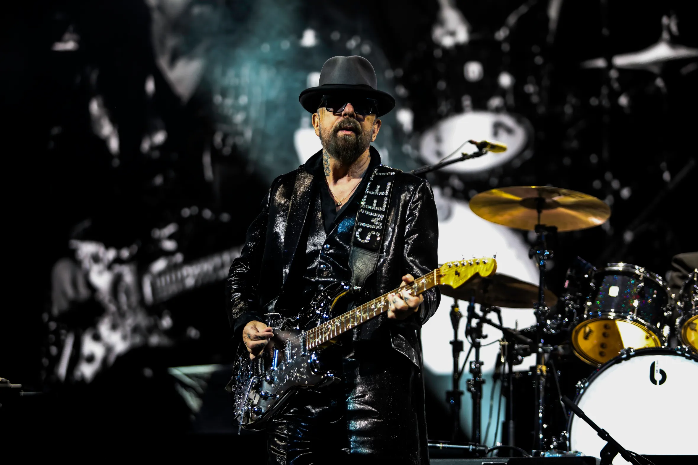 Dave Stewart of Eurythmics playing guitar on stage.
