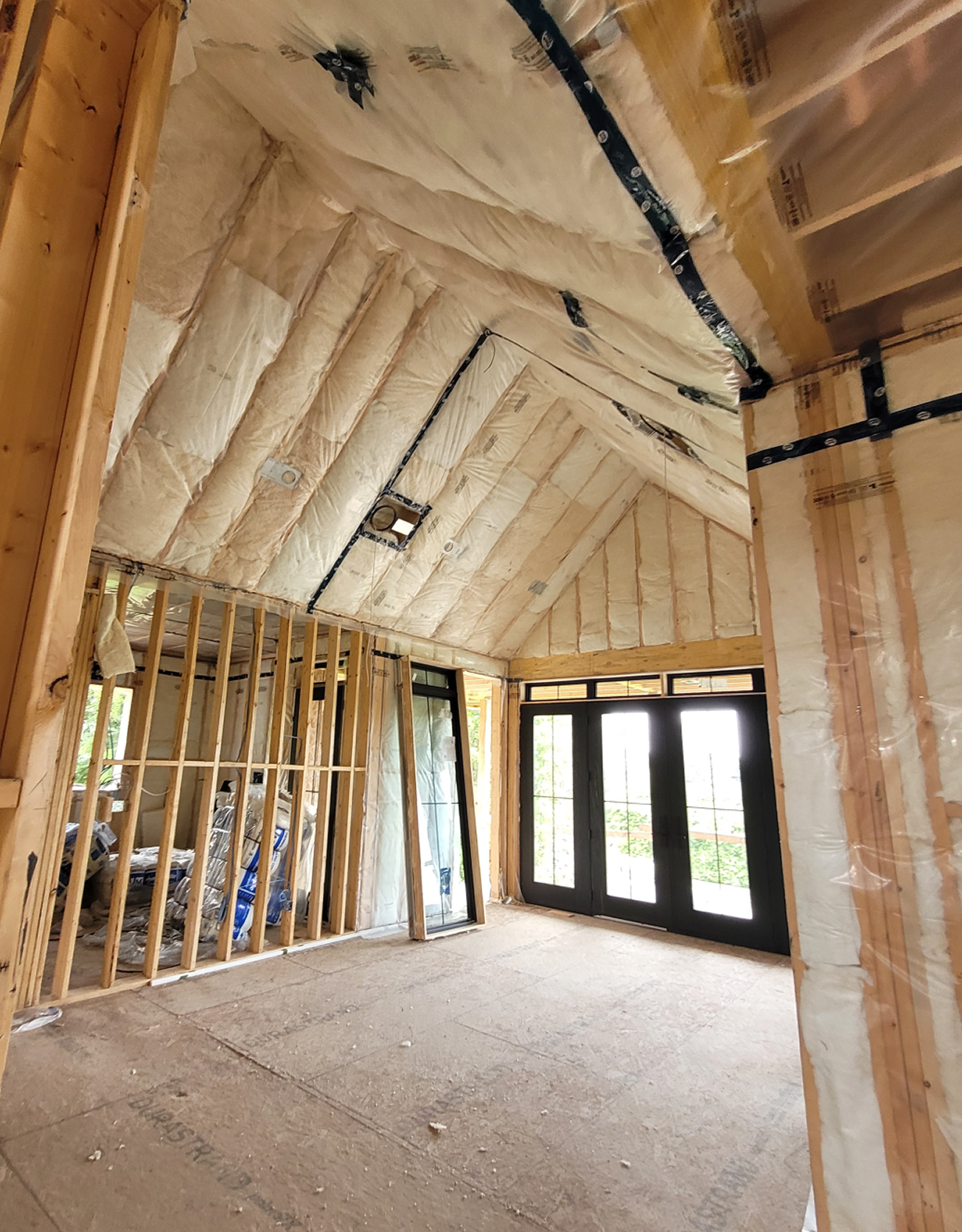 House in construction iwth some insulation installed.