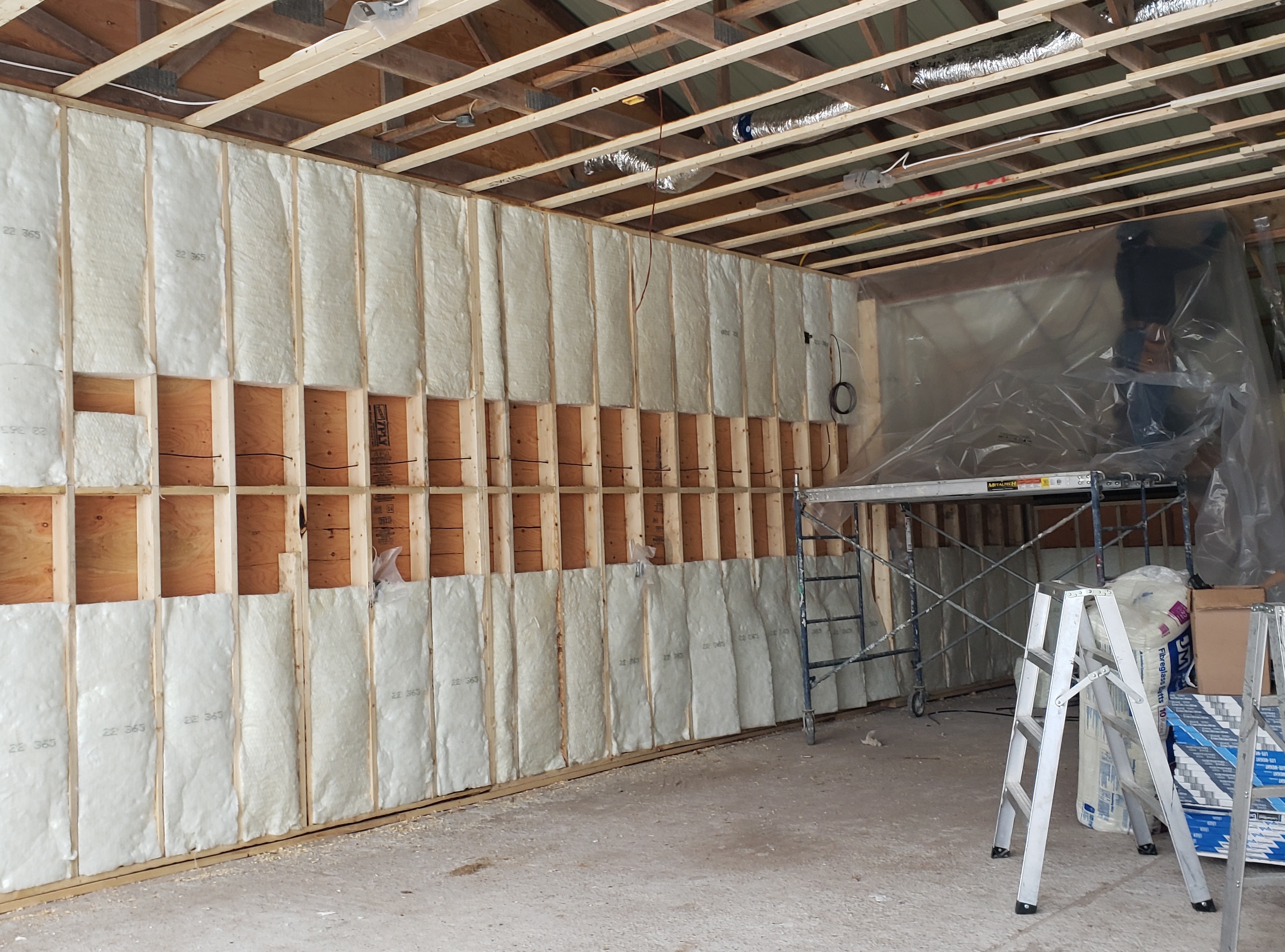 Garage with white insulation panels.