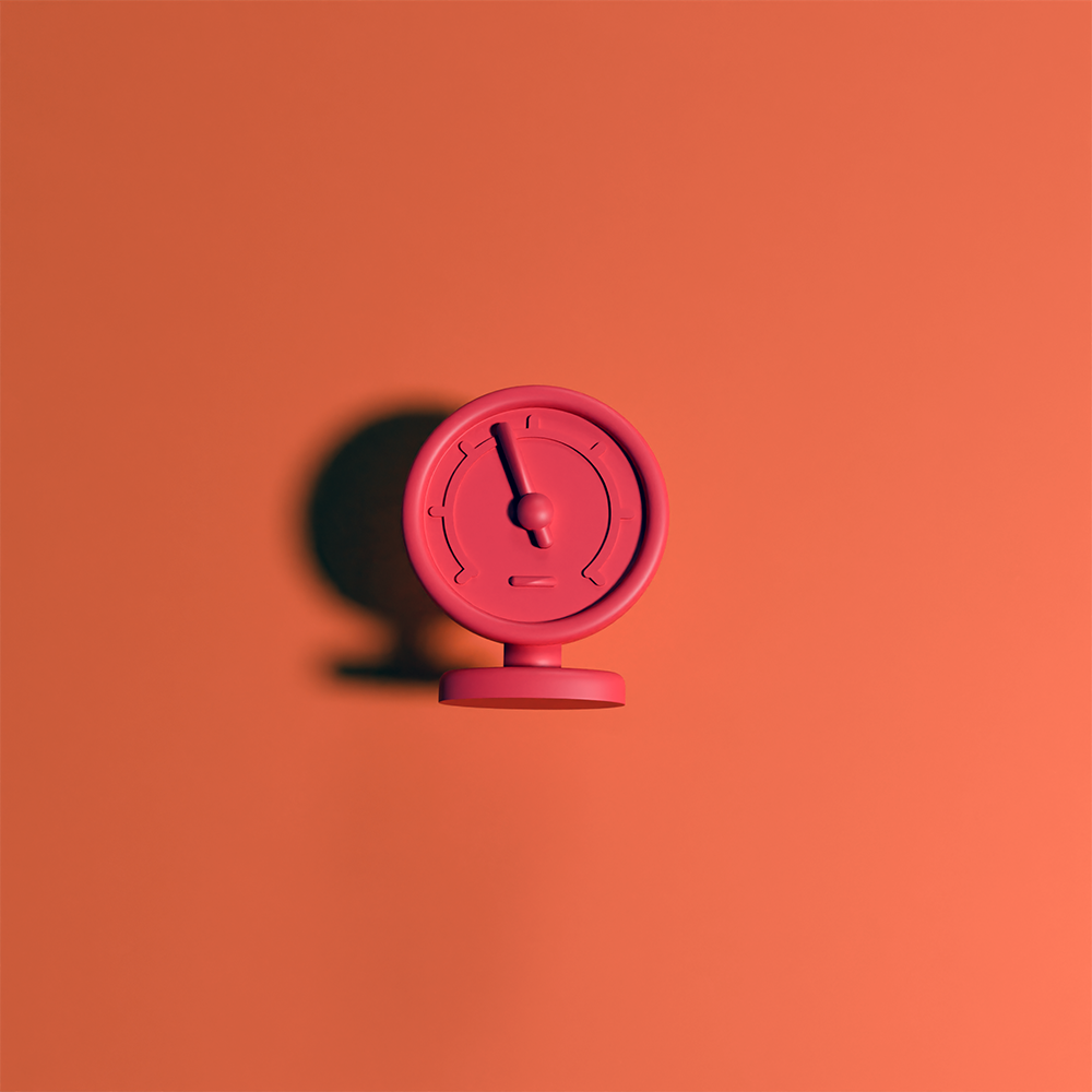 Red circular pressure gauge icon casting a shadow on a red-orange background.