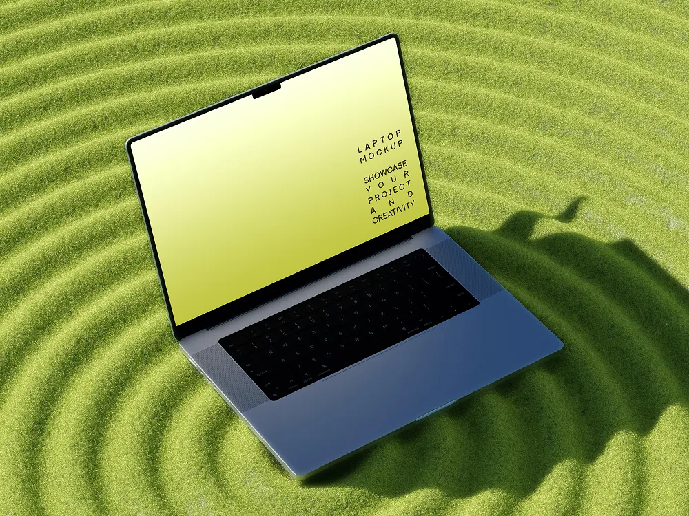 Open laptop with a yellow screen displaying the text 'Laptop mockup showcase your project and creativity' placed on green grass with concentric circular ripples and casting a shadow shaped like an elephant.
