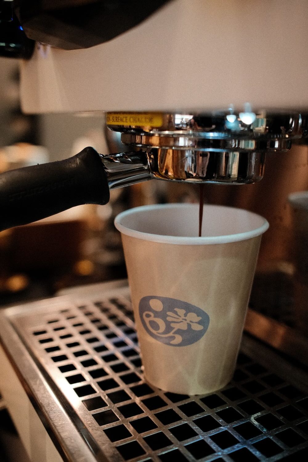 Espresso machine pouring shot into a cup.