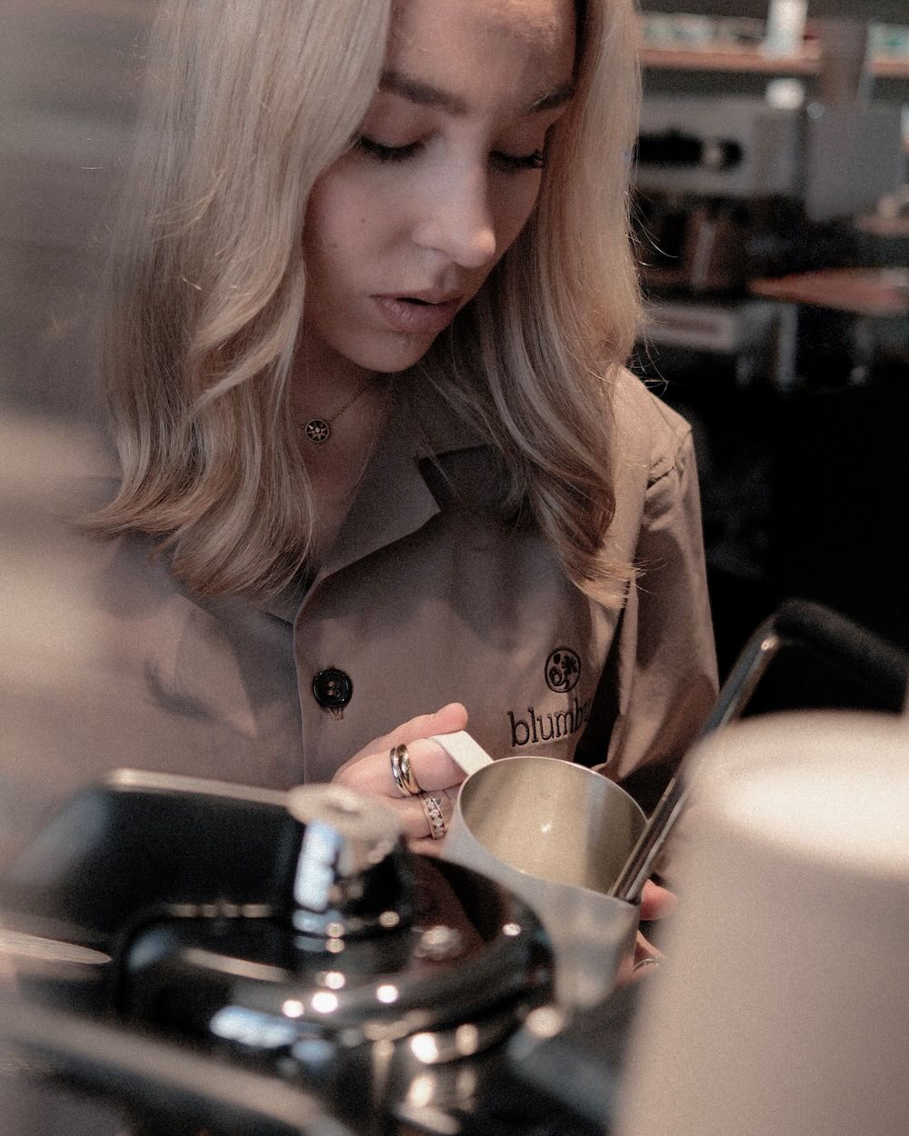 Barista frothing milk.