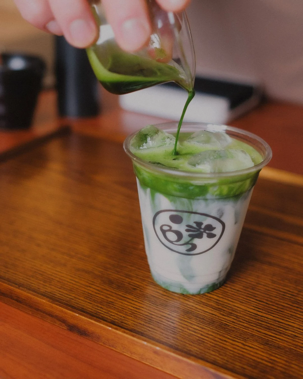 matcha latte preparation branded cup catering service