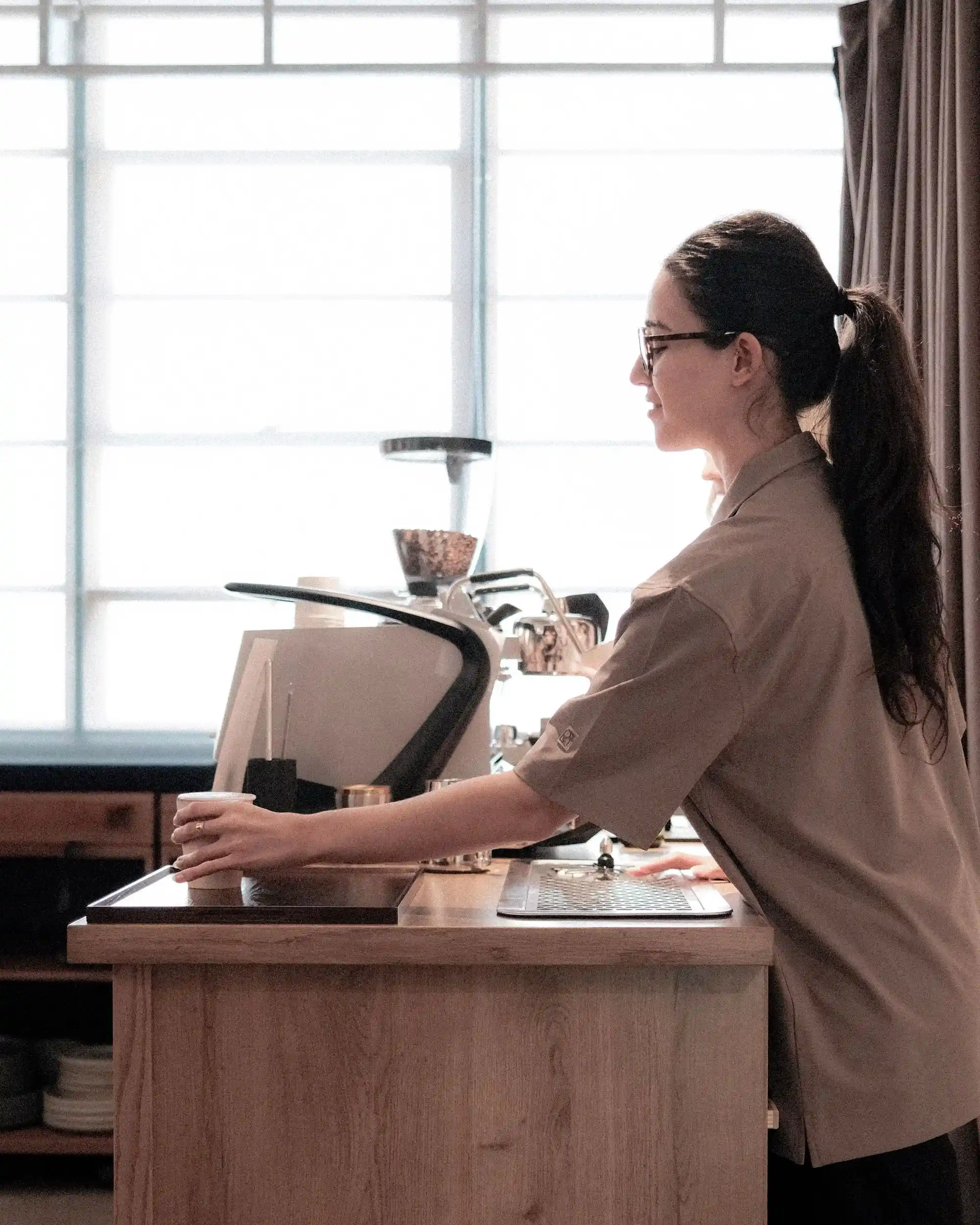 barista serving coffee for film catering event 