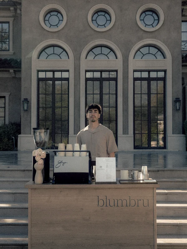 barista behind coffee cart for private event