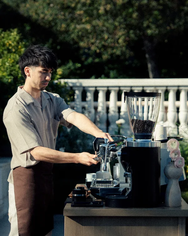 barista making espresso for private coffee catering event