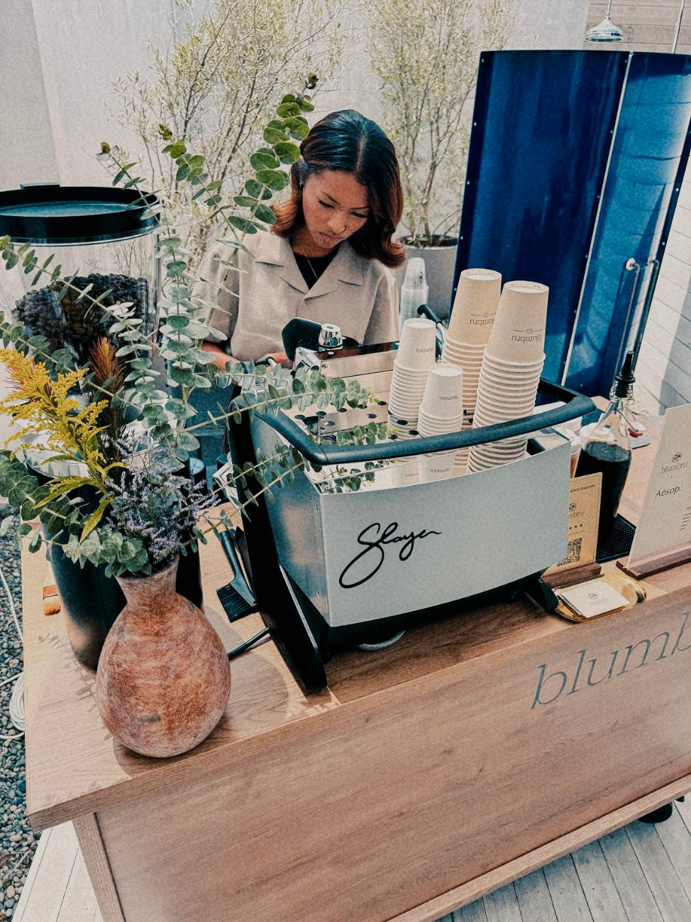 blumbru barista pulling shots on a Slayer espresso machine