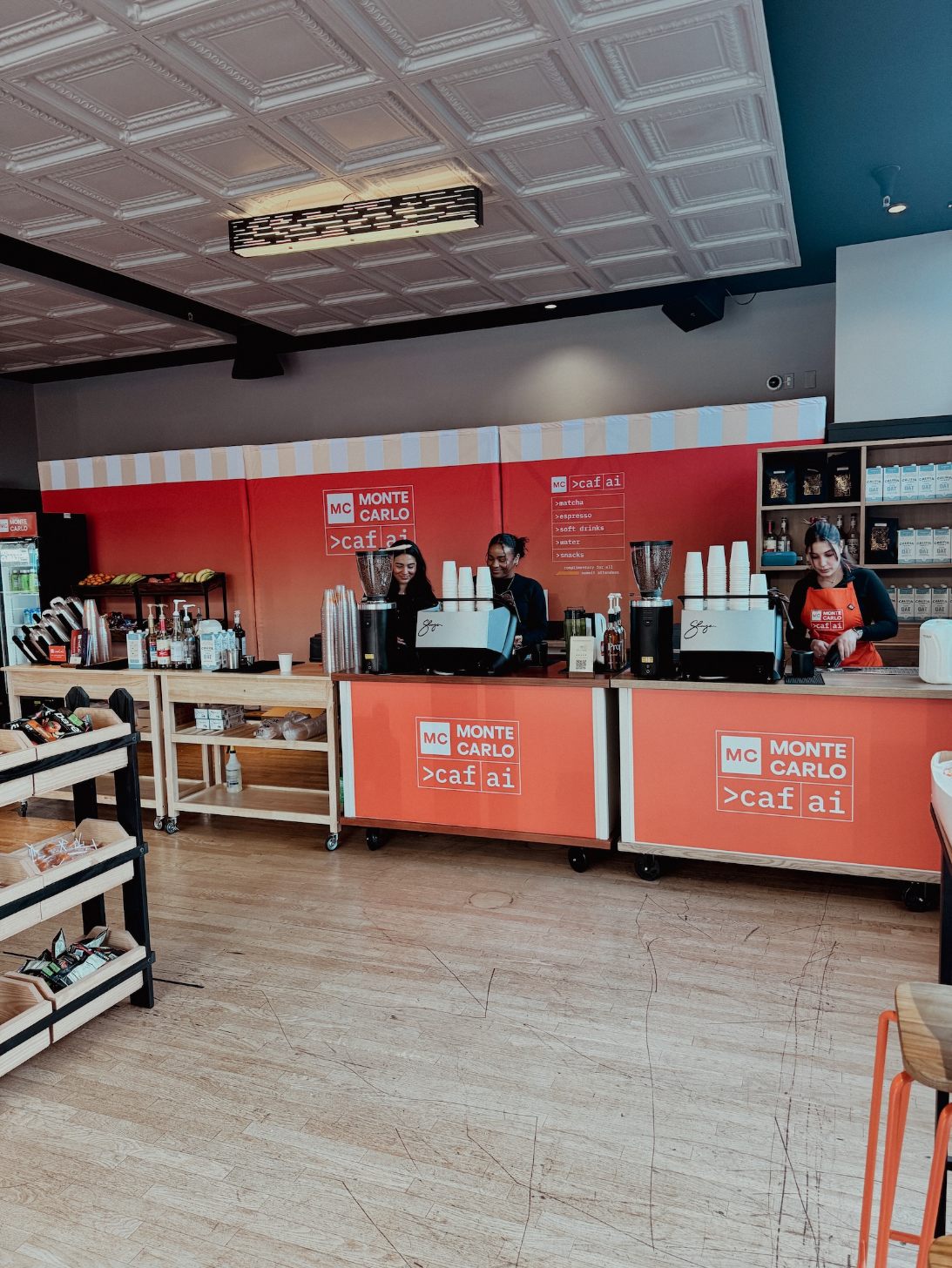 Two Monte Carlo branded espresso carts at a San Francisco conference