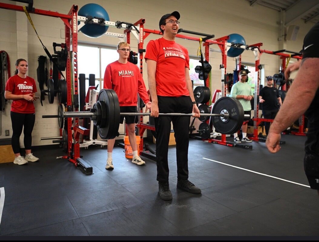 A powerlifter completing a deadlift at competition