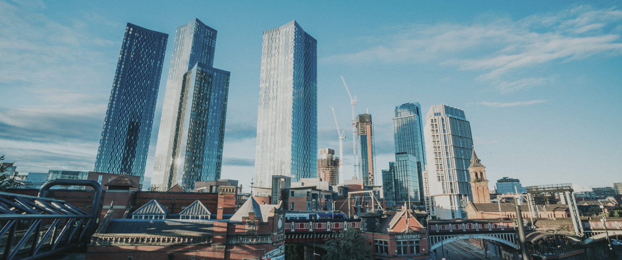 Architecture and infrastructure in Manchester reflecting the city's continued growth and investment in the built environment