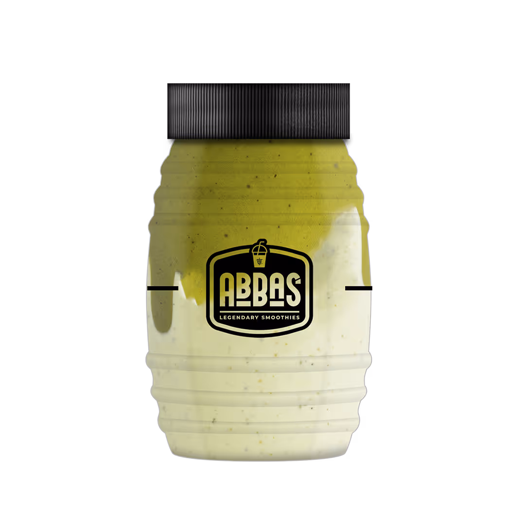 Plastic jar with a black lid containing a two-layered green and cream smoothie labeled ABBAS Legendary Smoothies.