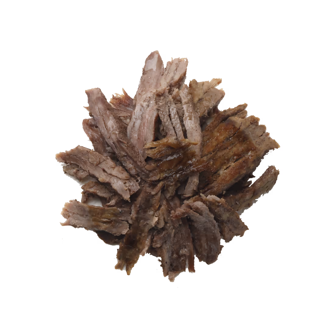 Pile of cooked, sliced beef on a white background.