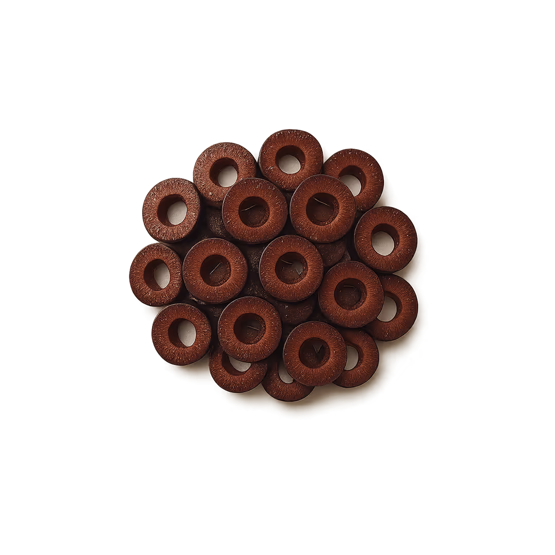 Sliced Kalamata olives arranged in a cluster on a plain background.