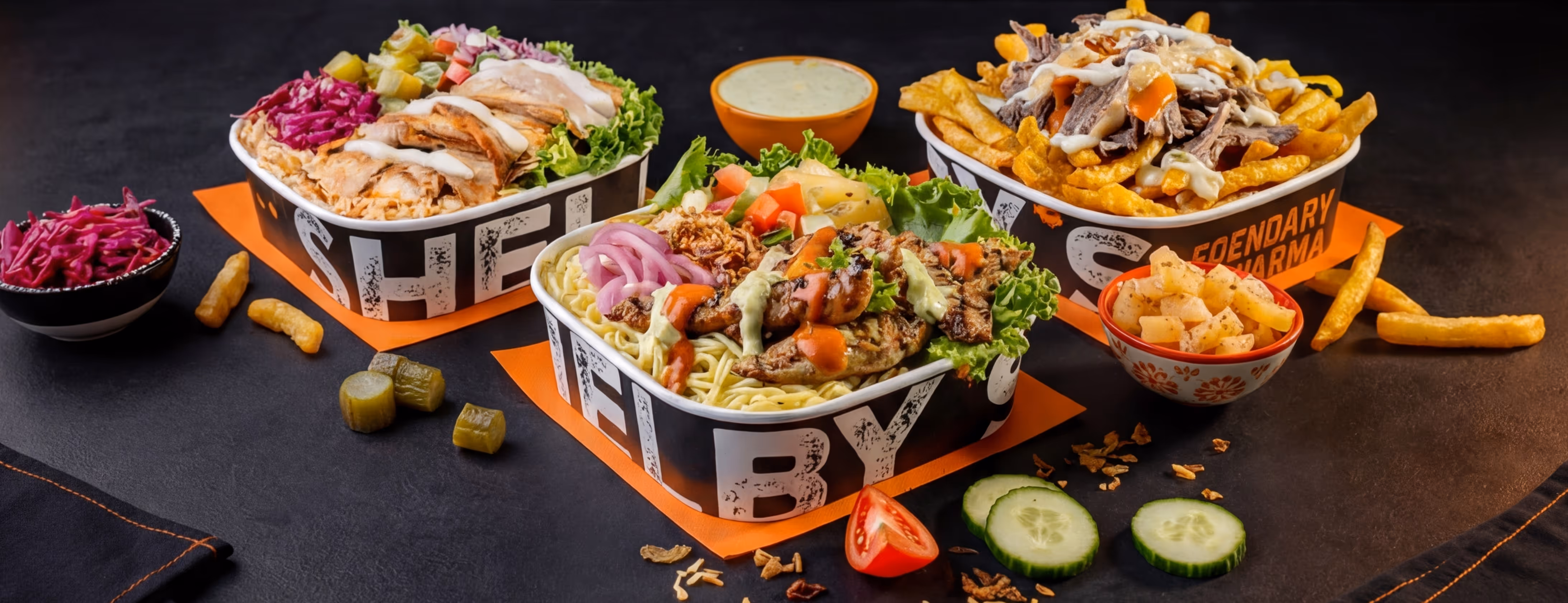 White stylized Arabic letter with the text 'MADE WIZ LOVE' on an orange background with faint food illustrations and phrases.