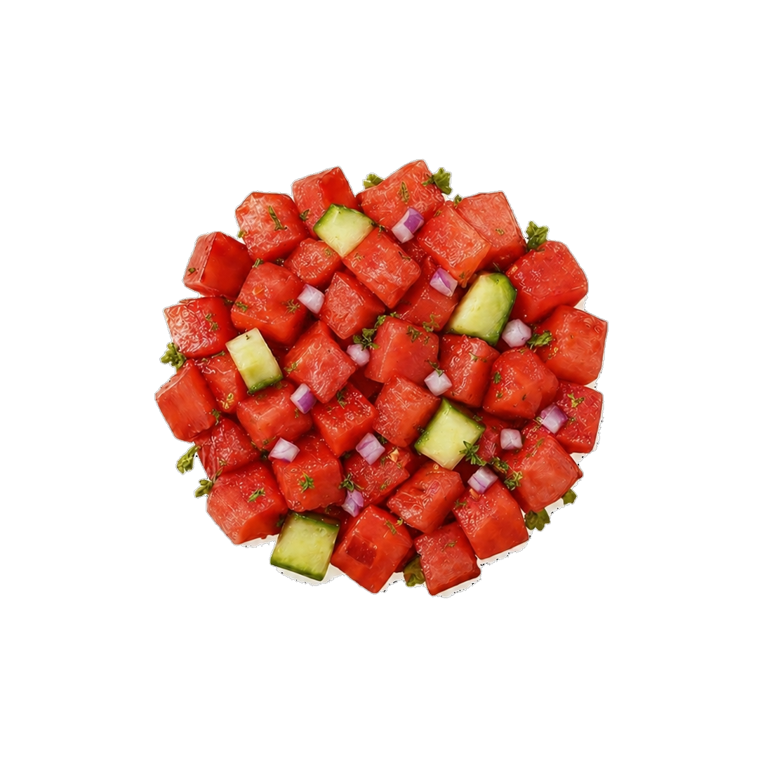 Diced watermelon and cucumber cubes garnished with small green herbs on a white background.