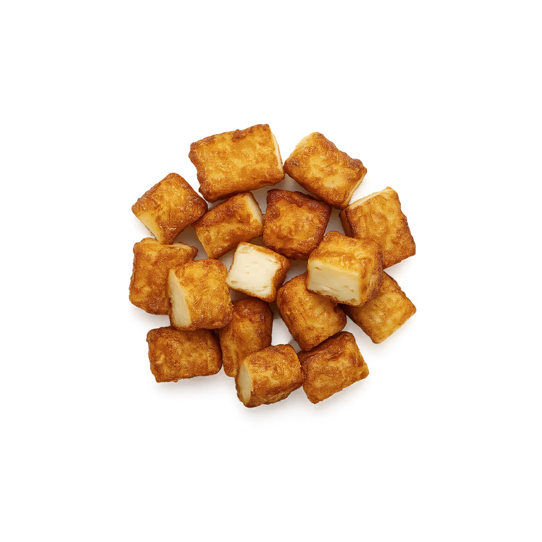 Cubed halloumi cheese seasoned with herbs and drizzled with dark balsamic glaze.