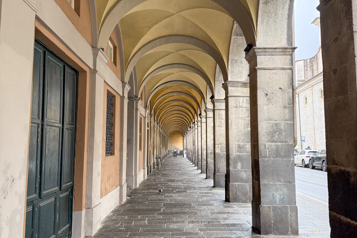 Arched covered walkway in Lucca, Italy.