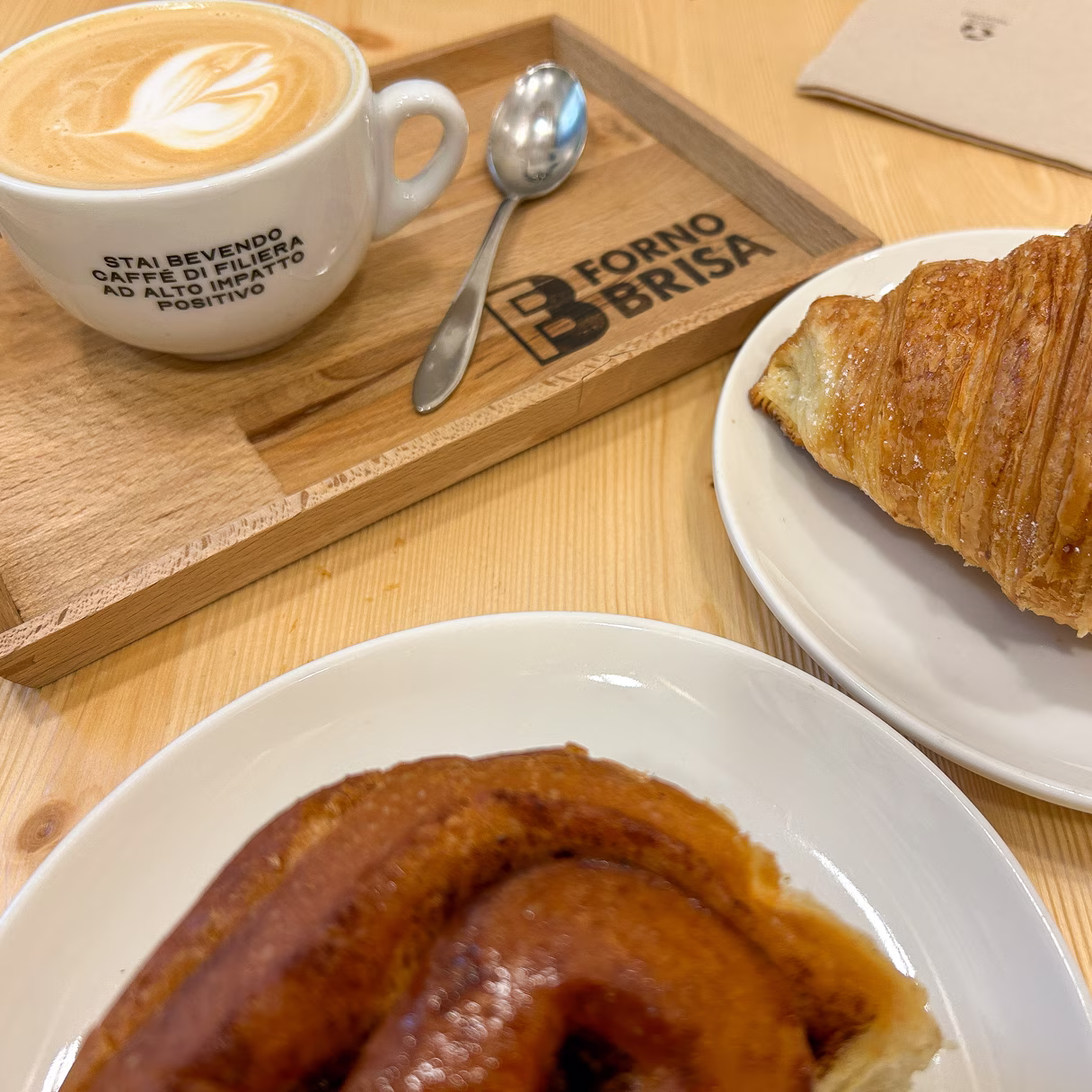 Two pastries and a cappuccino from Forno Brisa in Bologna, Italy.