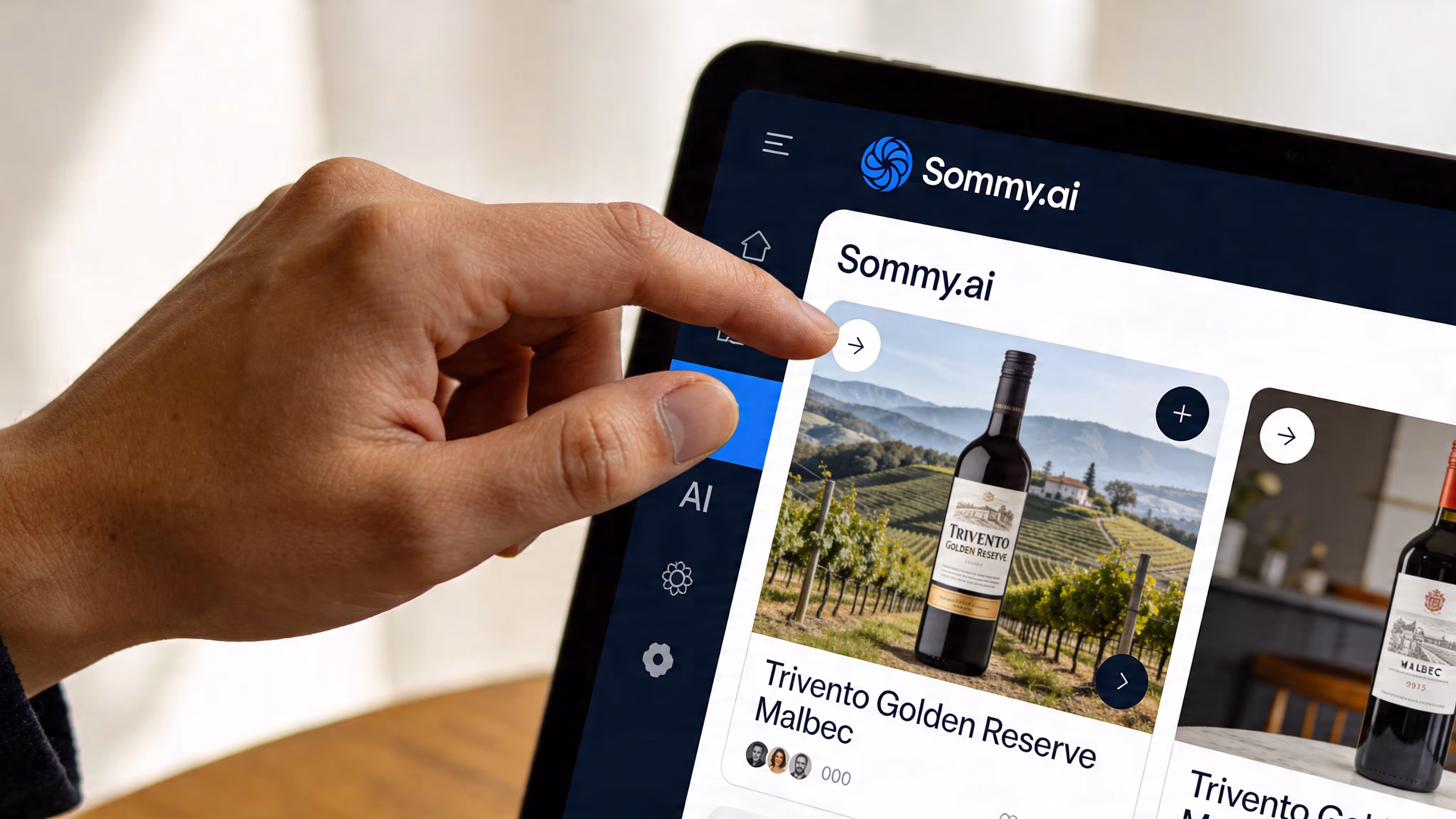 A hand interacting with the Sommy.ai website interface displaying a bottle of Trivento Golden Reserve Malbec wine.