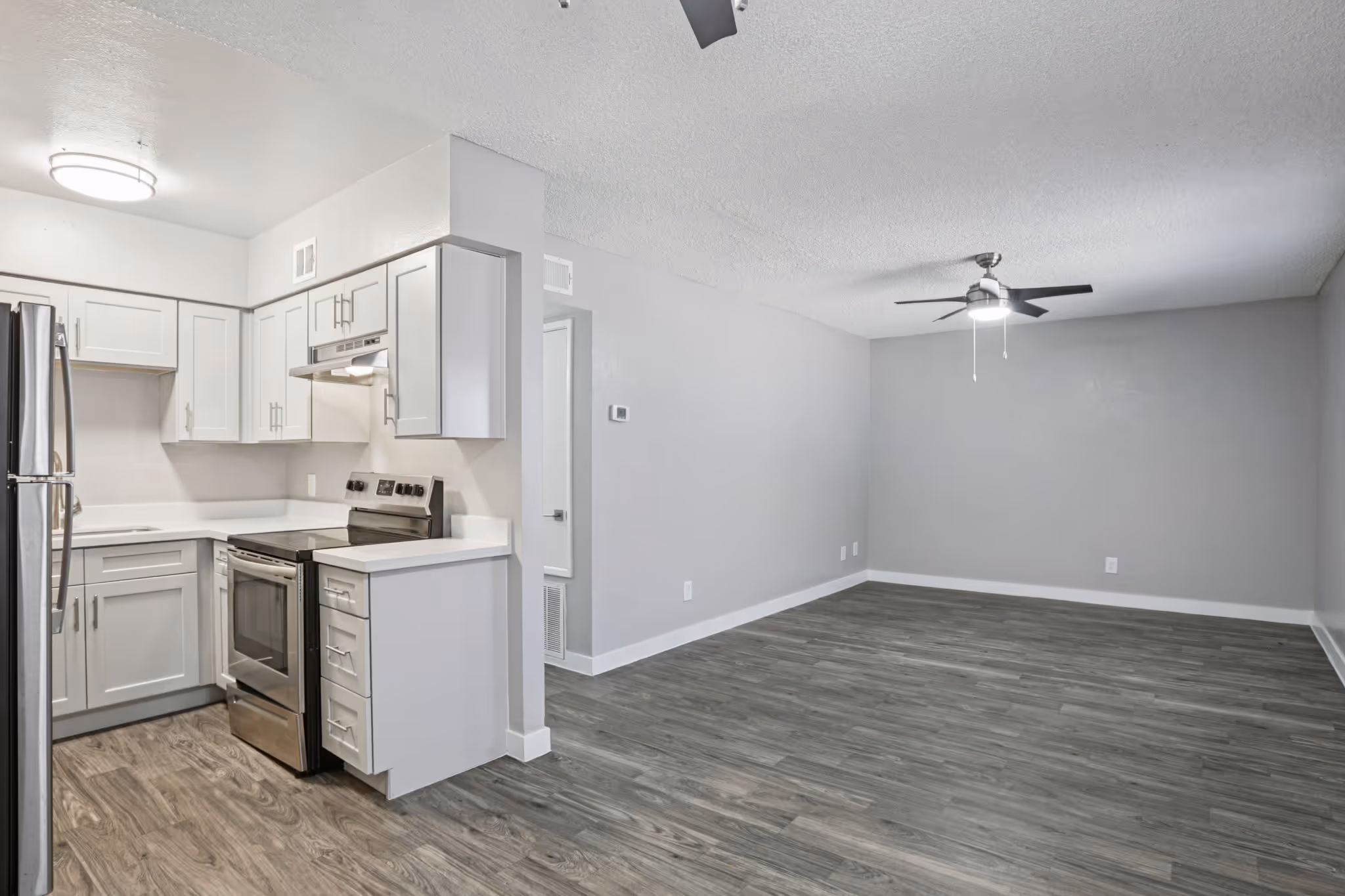View of kitchen and living area unfurnished