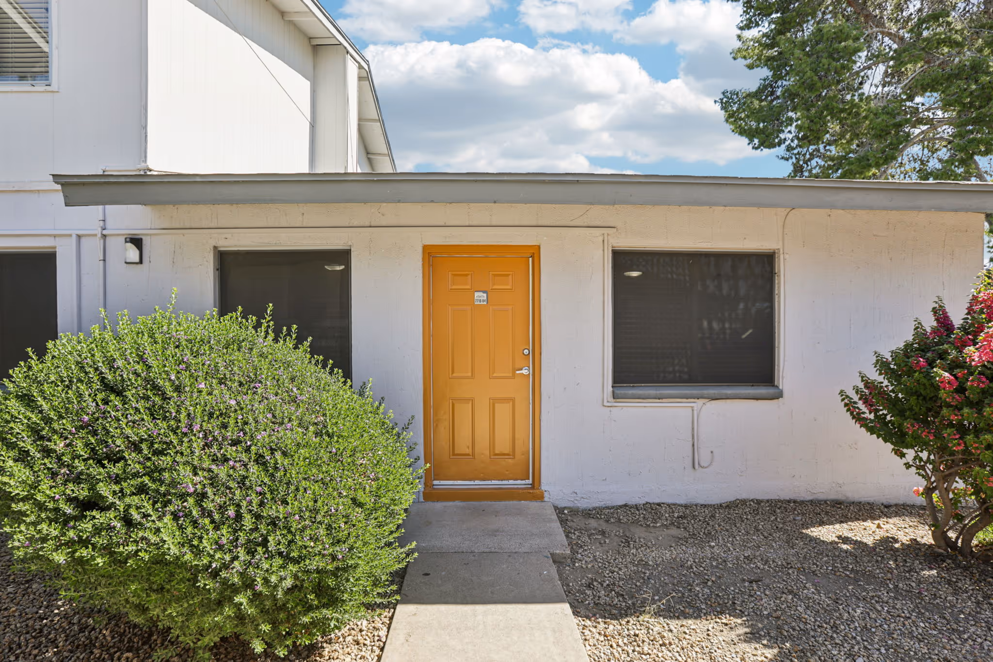 apartment exterior with orange door