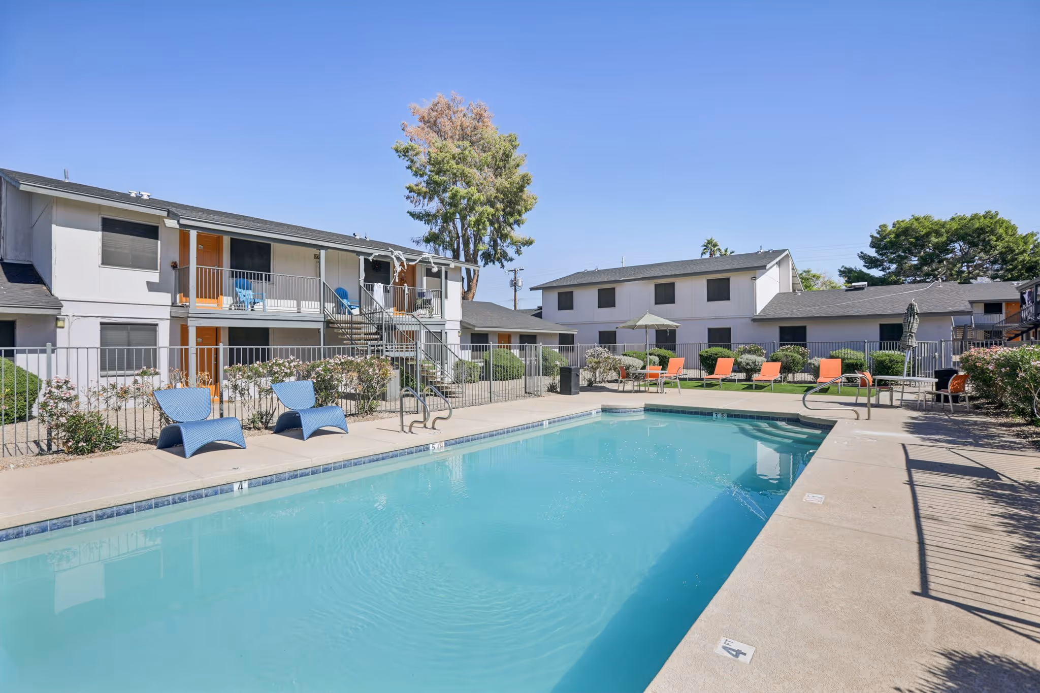 swimming pool with longe chairs