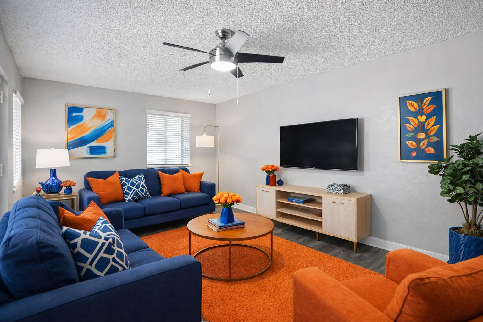 living room with blue couch and blue chairs