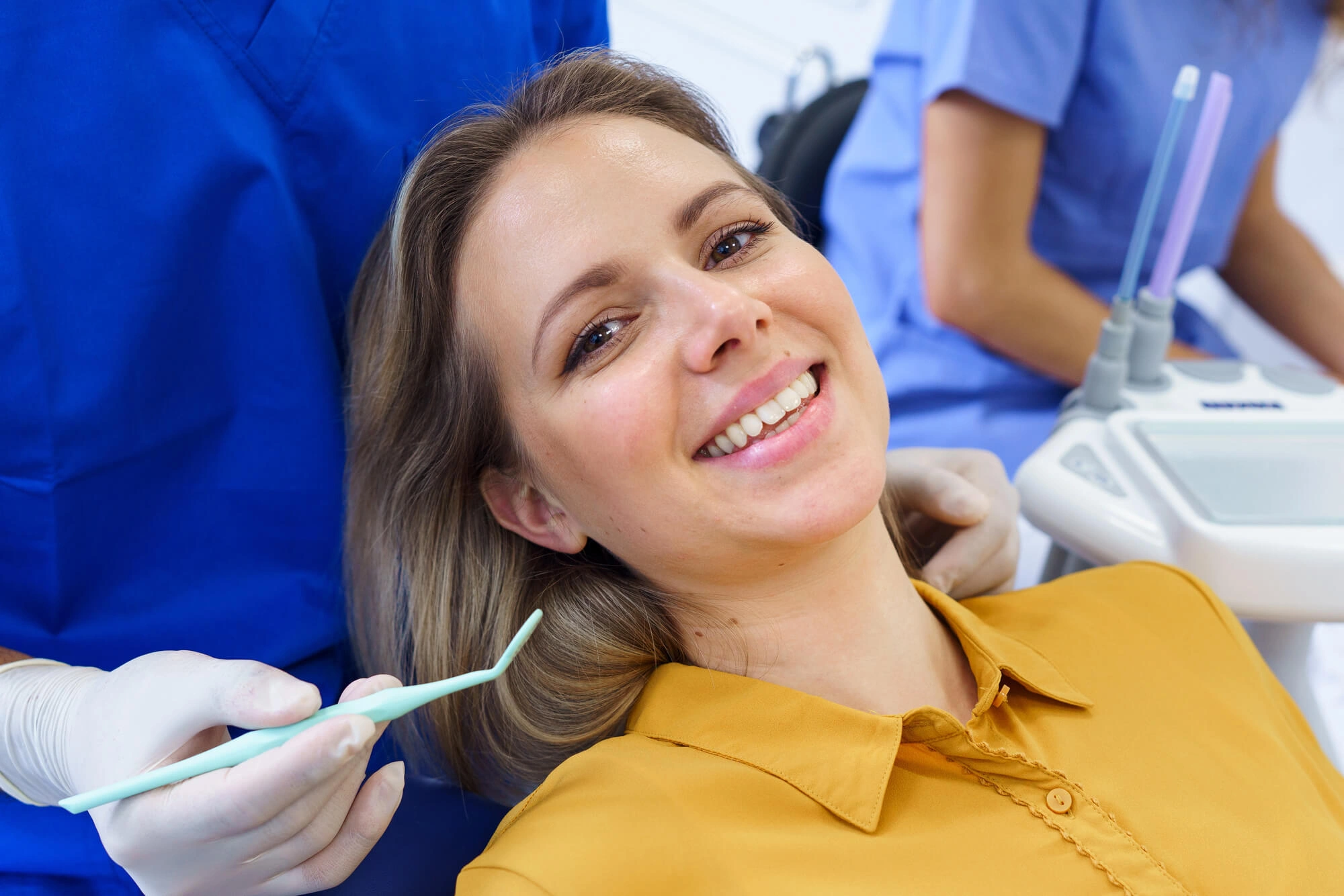 Woman smiling after getting dental bridges allentown