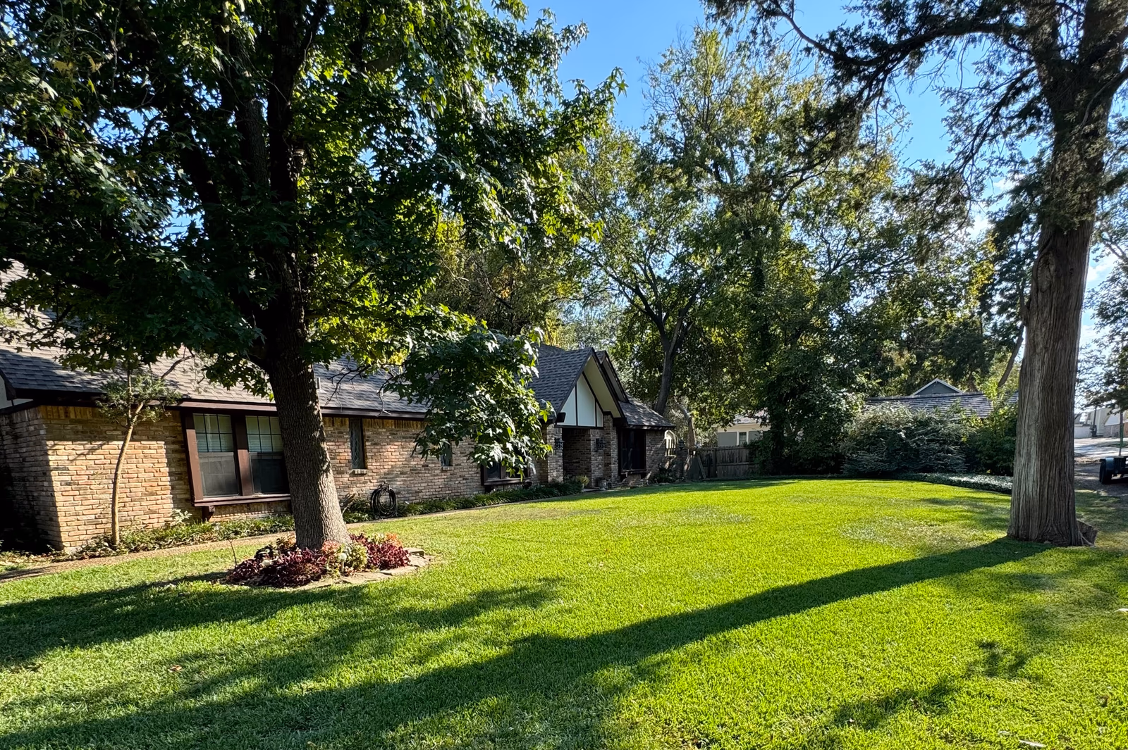 Established East Texas lawn and landscape cared for by Saddle Rock Land Co.