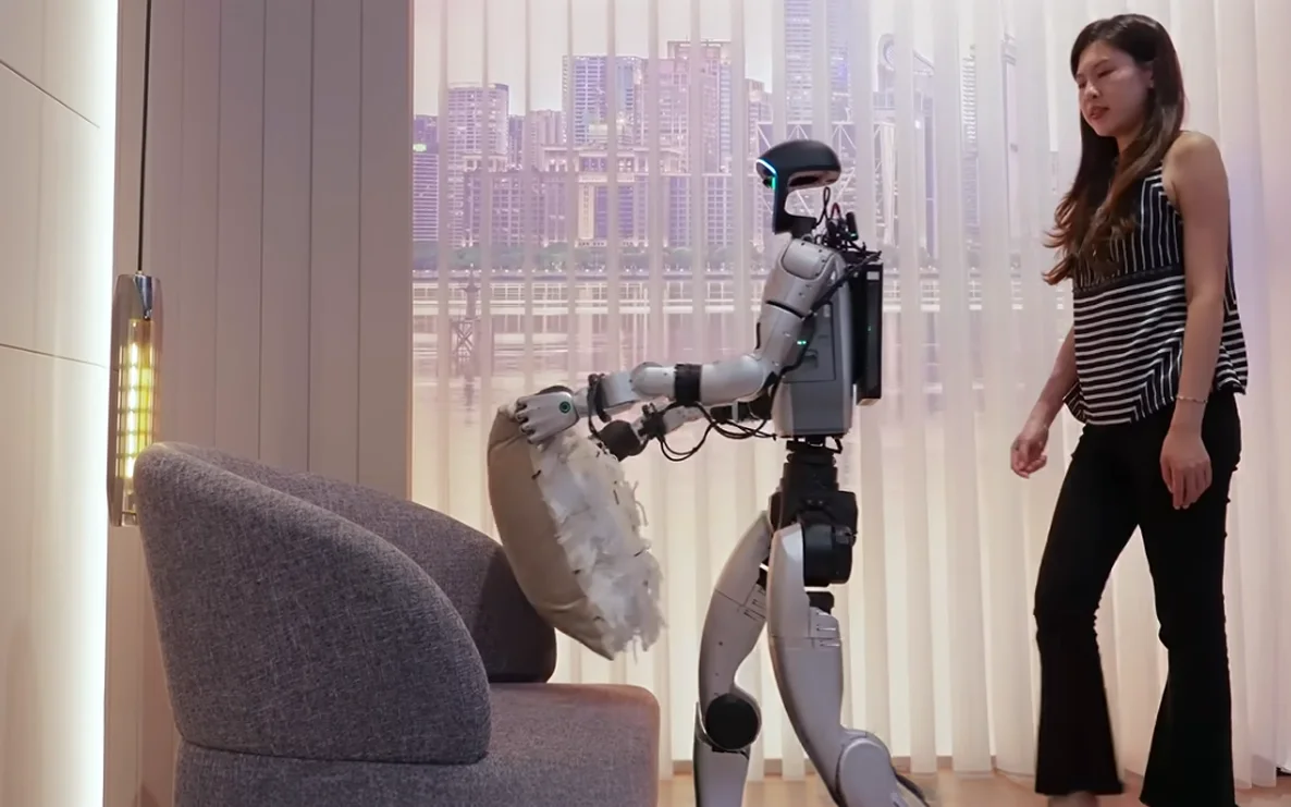 Unitree Robot with UnifoLM-OminiA-0.3 combining interactive understanding with whole-body mobile manipulation moving a cushion