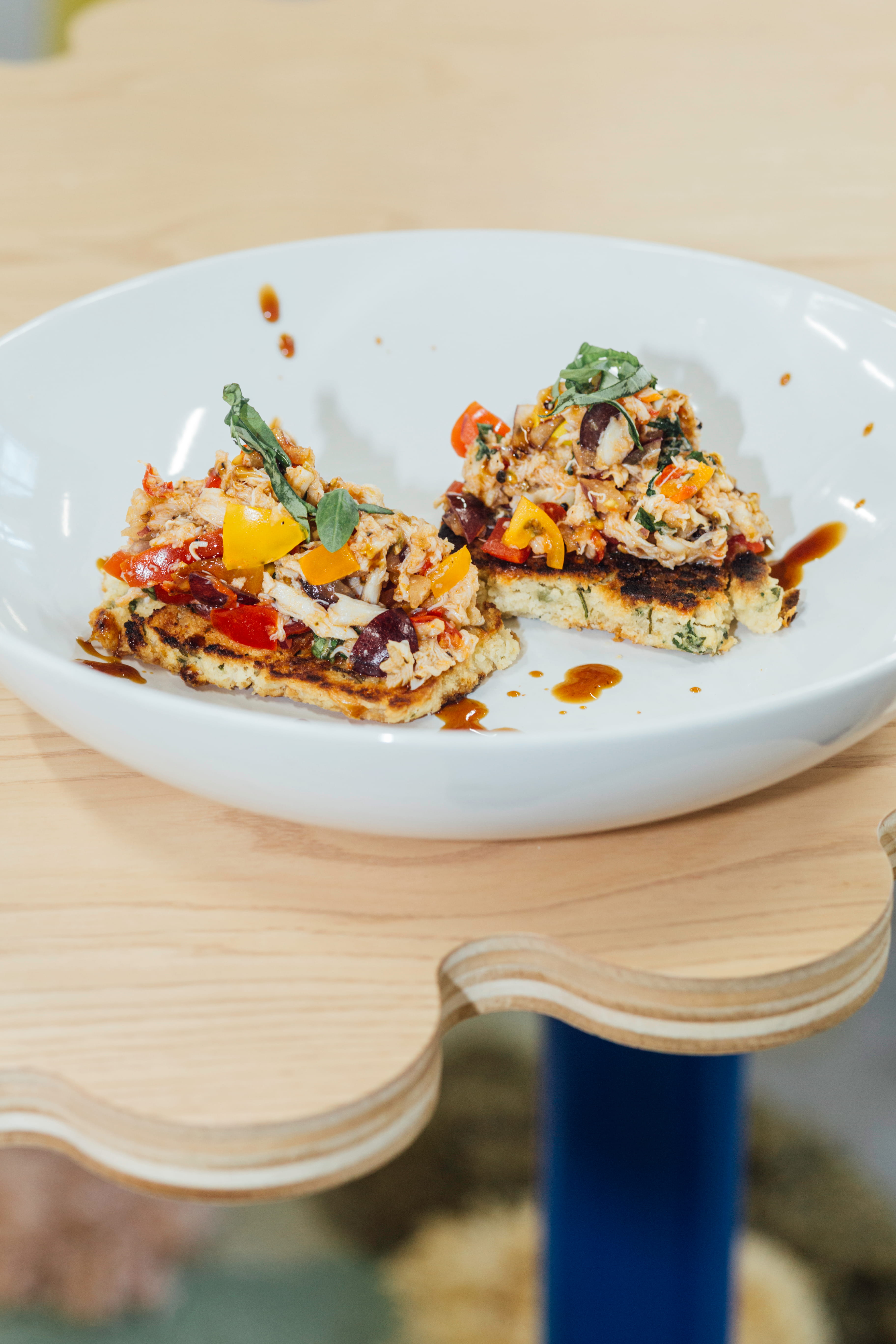 Lump crab, heirloom tomato, Calabrian chili, herby & cheese buttermilk biscuit