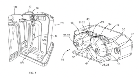 Line drawing of an electronic device shown from two angles, featuring a circular dial and various rectangular and square components.