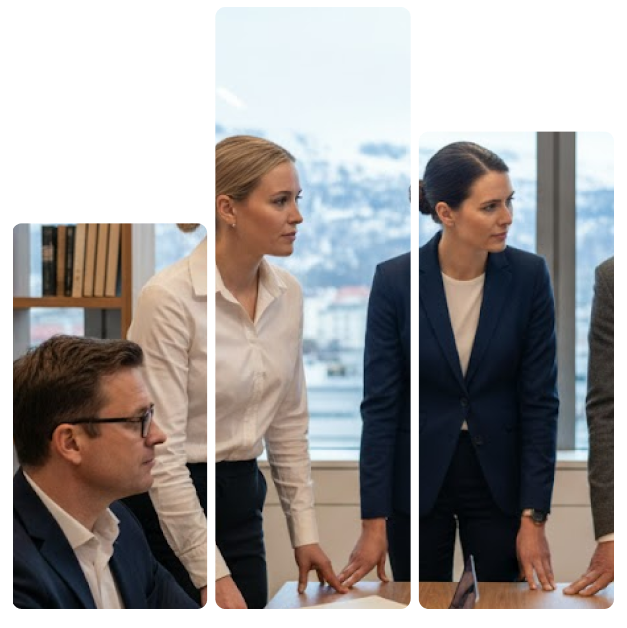 Three professionals in business attire engaged in a meeting by a table, with a snowy mountain landscape visible through the window behind them.