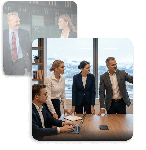 Business team in formal attire having a meeting in a modern office with large windows showing a snowy mountain view.
