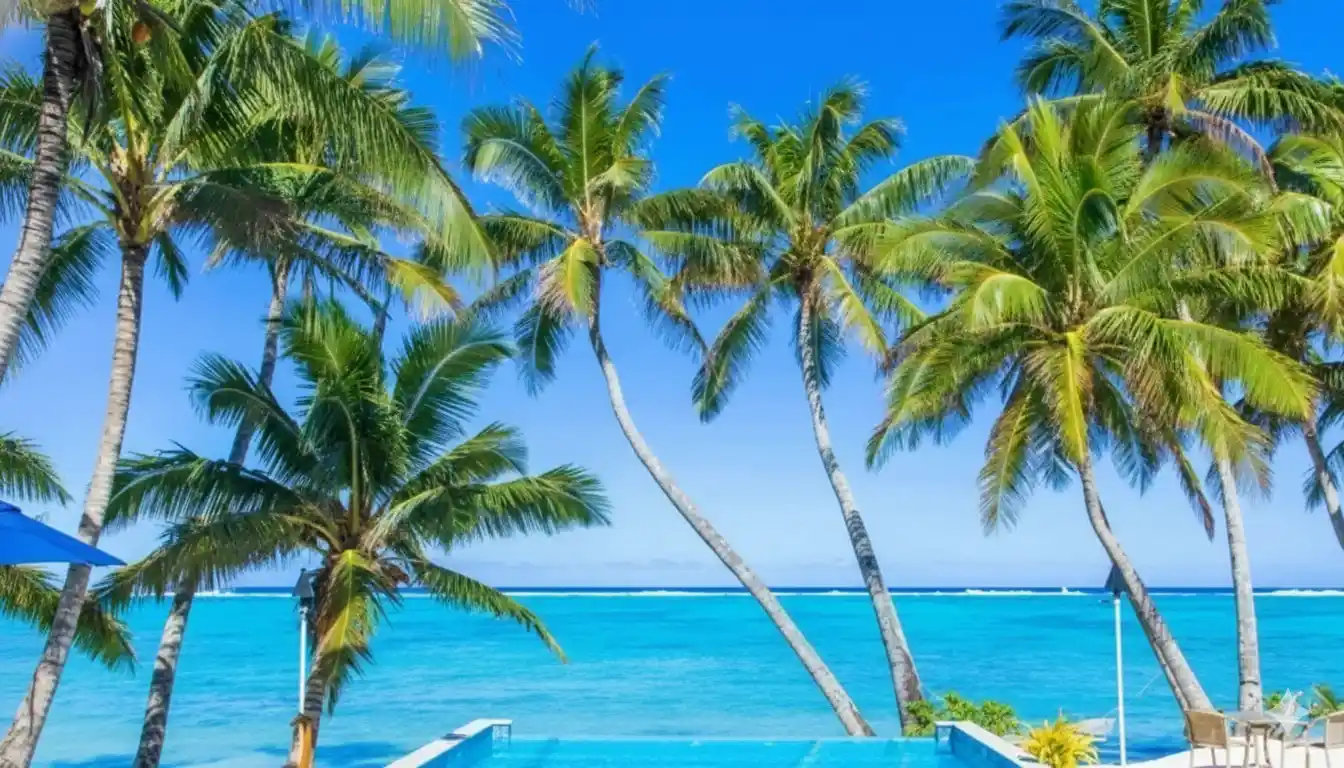  Scenic view of the ocean and mountains from a hilltop, showcasing the natural beauty of the landscape.