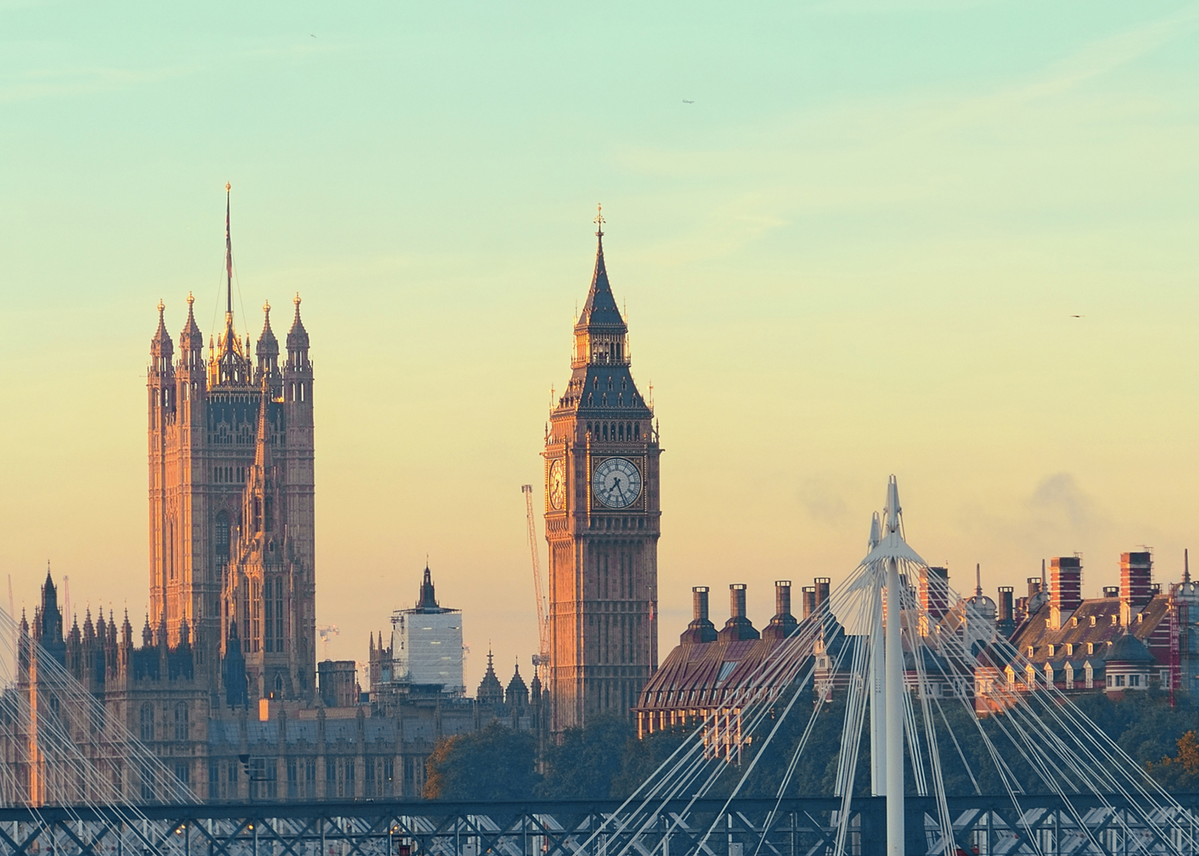  Scenic view of the ocean and mountains from a hilltop, showcasing the natural beauty of the landscape.