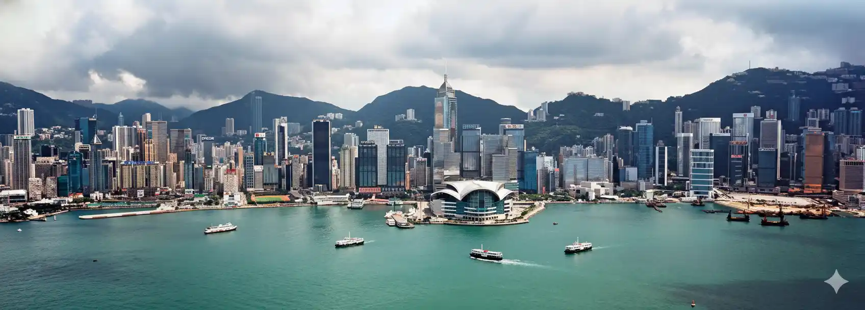  Scenic view of the ocean and mountains from a hilltop, showcasing the natural beauty of the landscape.