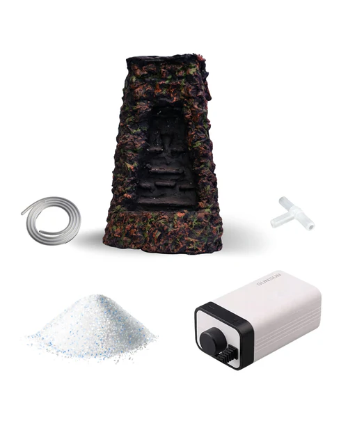 Aquarium decoration waterfall with tube, T-shaped connector, filter media, and water pump.
