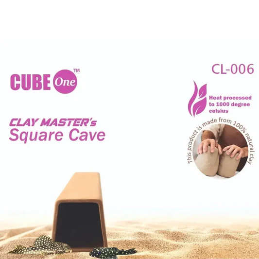 CUBE One Clay Master's Square Cave CL-006 made from 100% natural clay, heat processed to 1000 degrees Celsius, shown partially buried in sand with fish nearby.